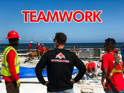 RoofCrafters Roofing team on a flat roof