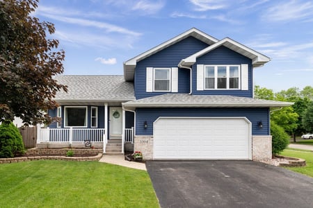 Architectural shingles on a blue and white home