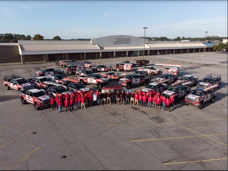 RoofCrafters team standing in front of RoofCrafters trucks-1