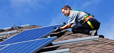 installer installing solar panels