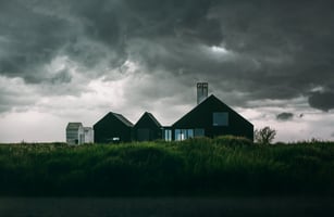 home in the midst of an incoming storm