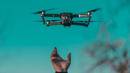 drone being launched by hand