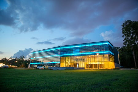 glass building with blue roof