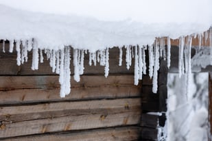 icicles and snow on home