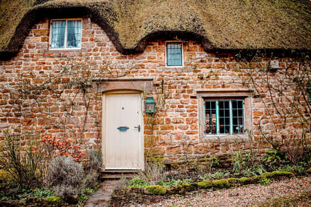 english cottage with thatched roof