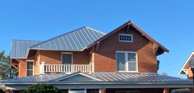 galvalume standing seam metal roof on brick home