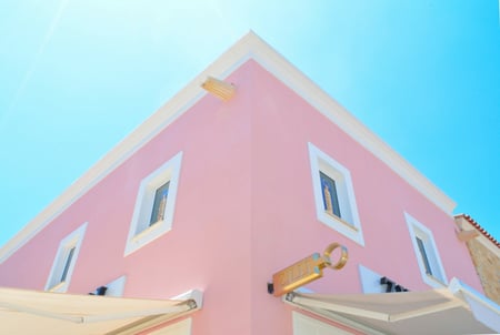 pink building with white roof