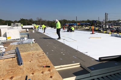 RoofCrafters installing a commercial flat roof replacement