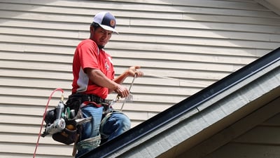 roofer working on a gable roof