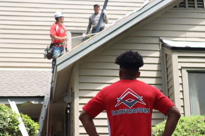 RoofCrafters supervisor inspecting crews work